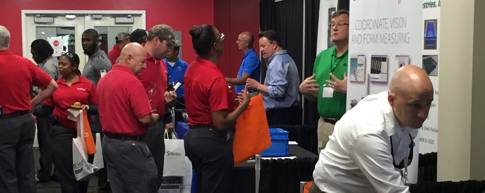 People learning about the various technologies exhibitors brought 9