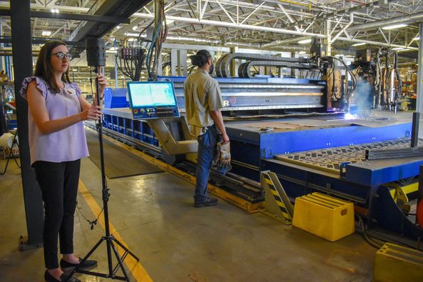 Emily Wall using a 3D camera to record Taylor Power operations